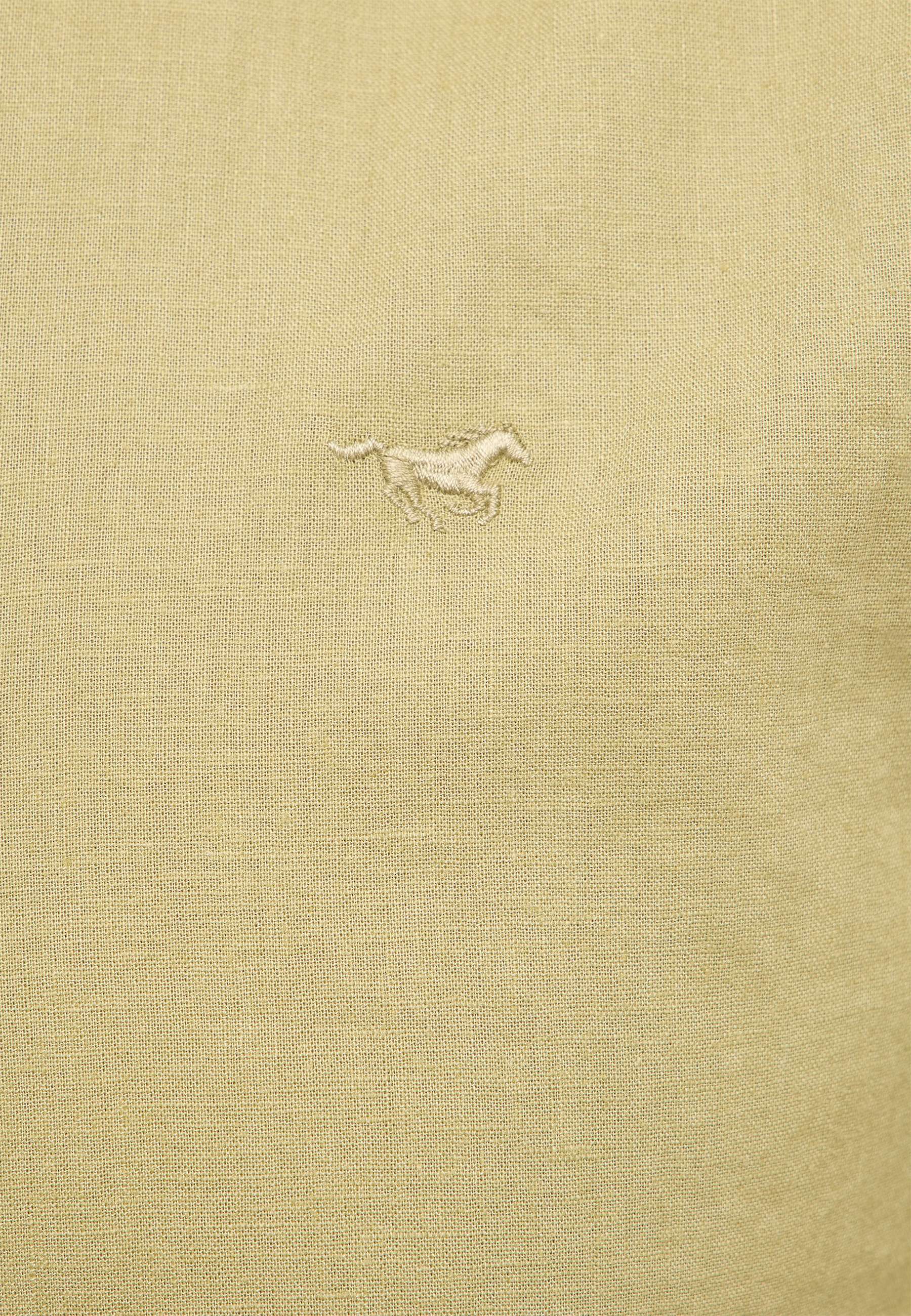 emblem, kleine stickerei, pferd, beige stoff, textilstruktur