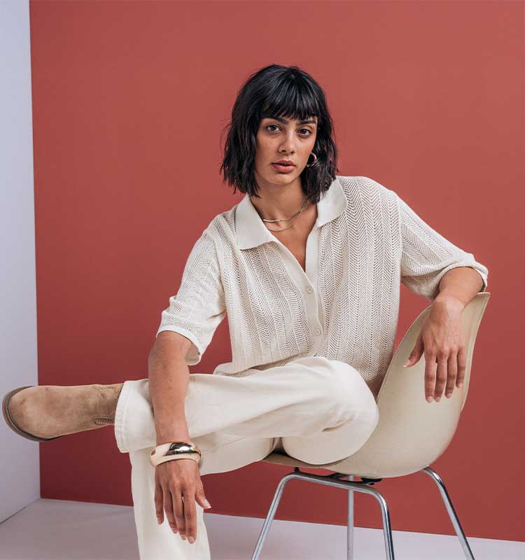 knit polo, cream sweater, loose knit, white pants, ankle boots